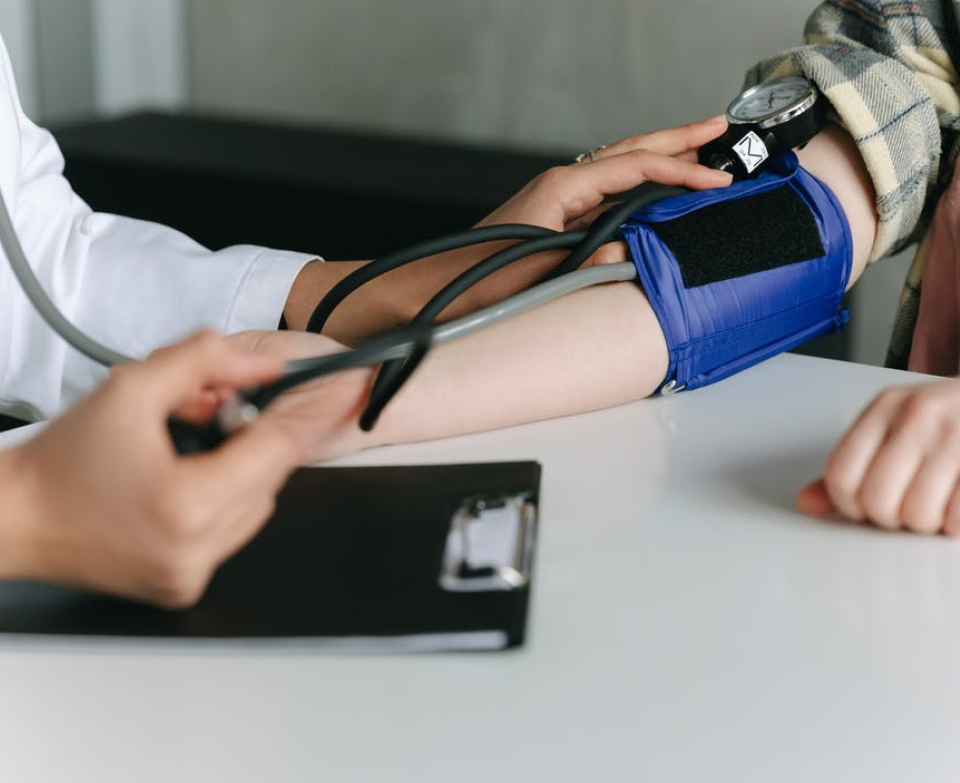 Doctor monitoring blood pressure